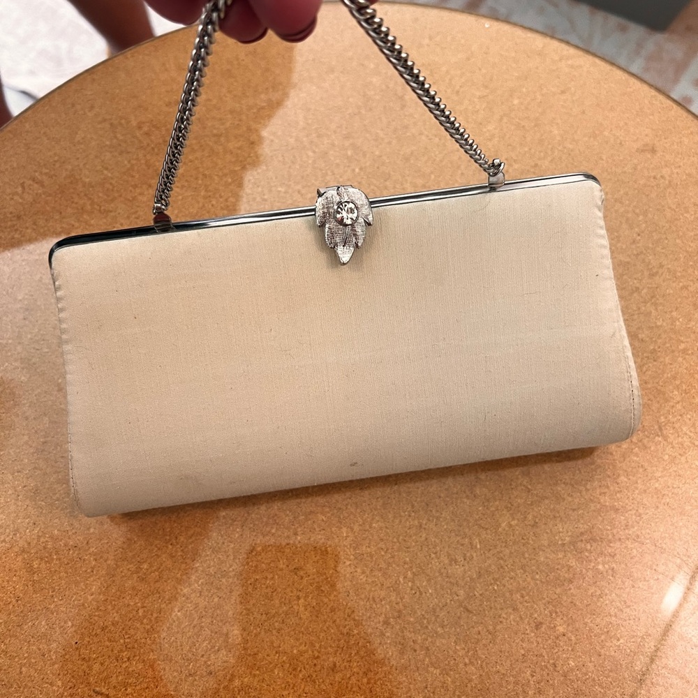 25% off listed price. Vintage formal clutch bag. Cream colored with chain handle